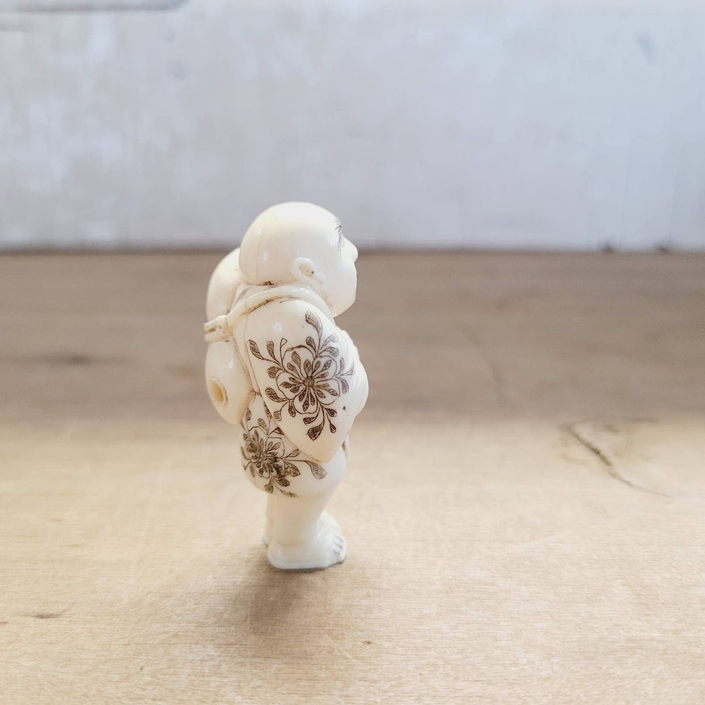 Japanese Antique Netsuke Sad Man with Flowers