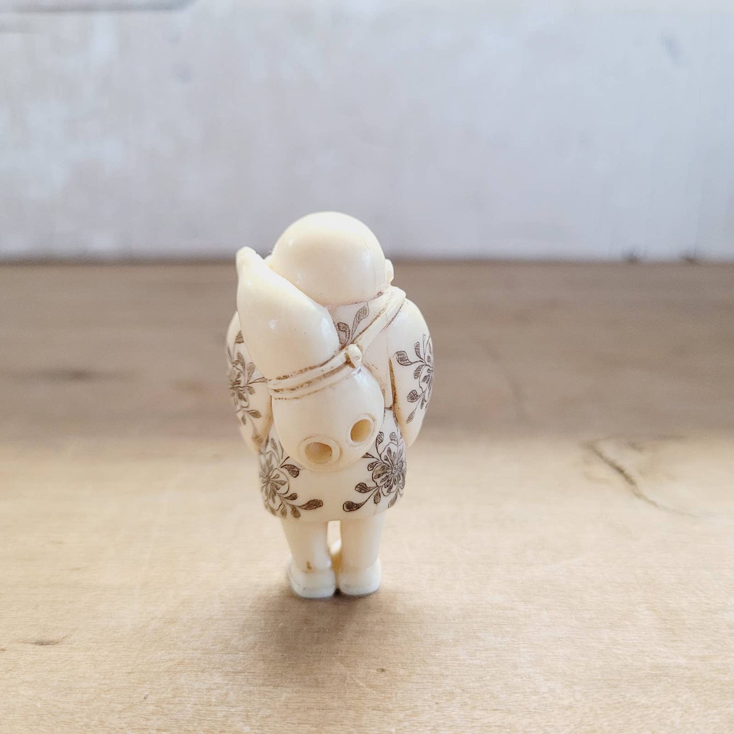 Japanese Antique Netsuke Sad Man with Flowers