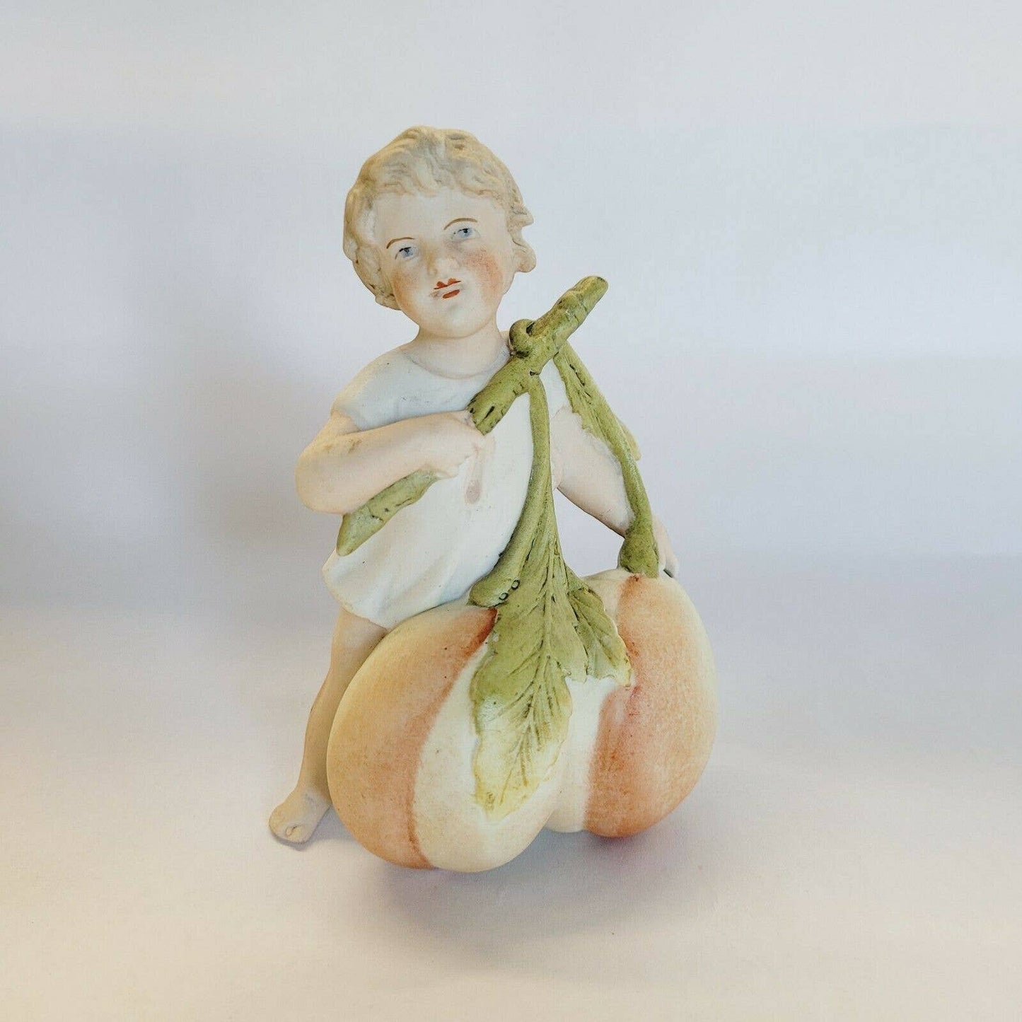 Antique Porcelain Bisque Boy with Peaches Planter 5 1/4" Figurine.